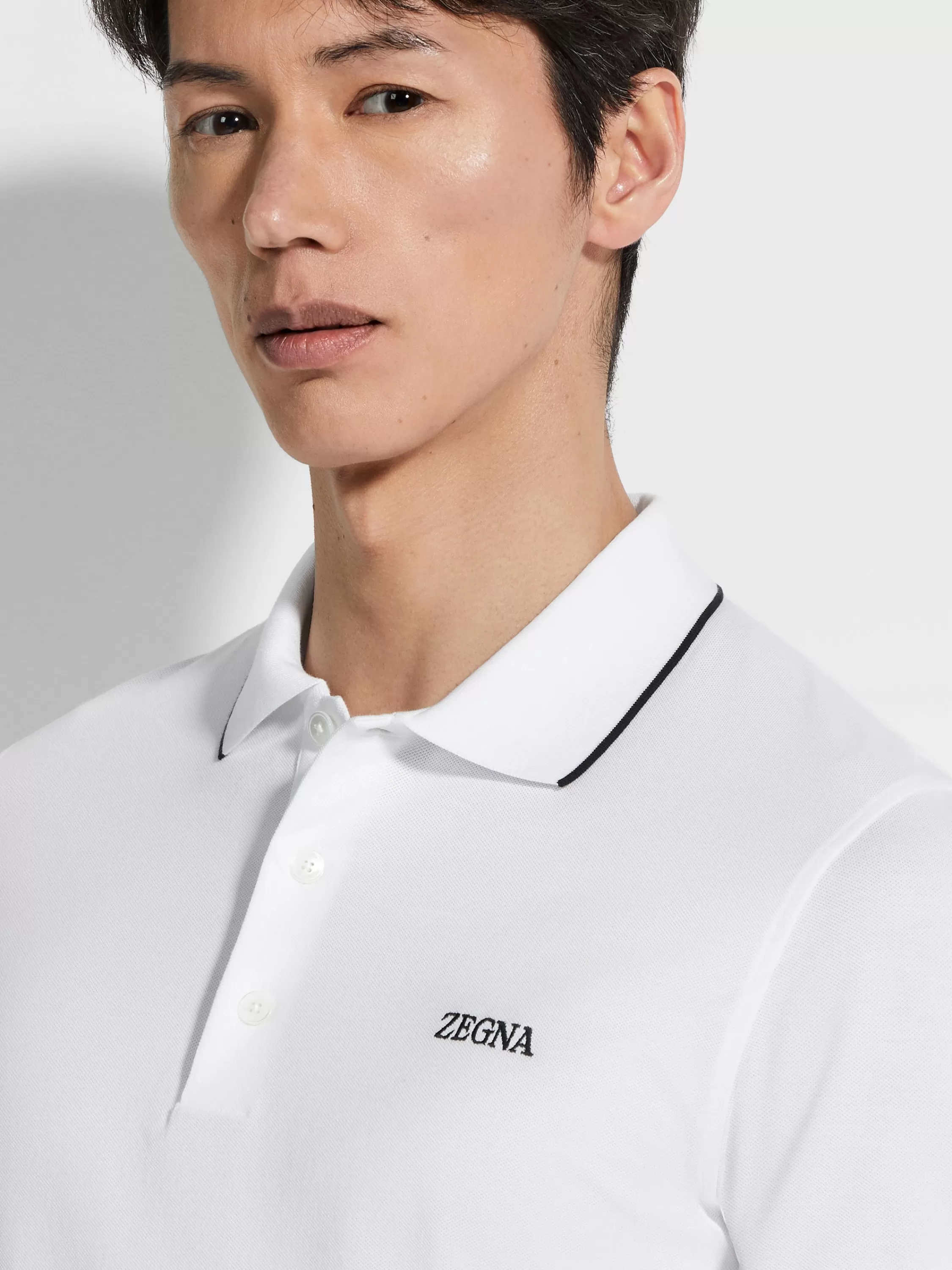 Sale Poloshirt aus Stretch-Baumwolle in optischem Weiß Poloshirts
